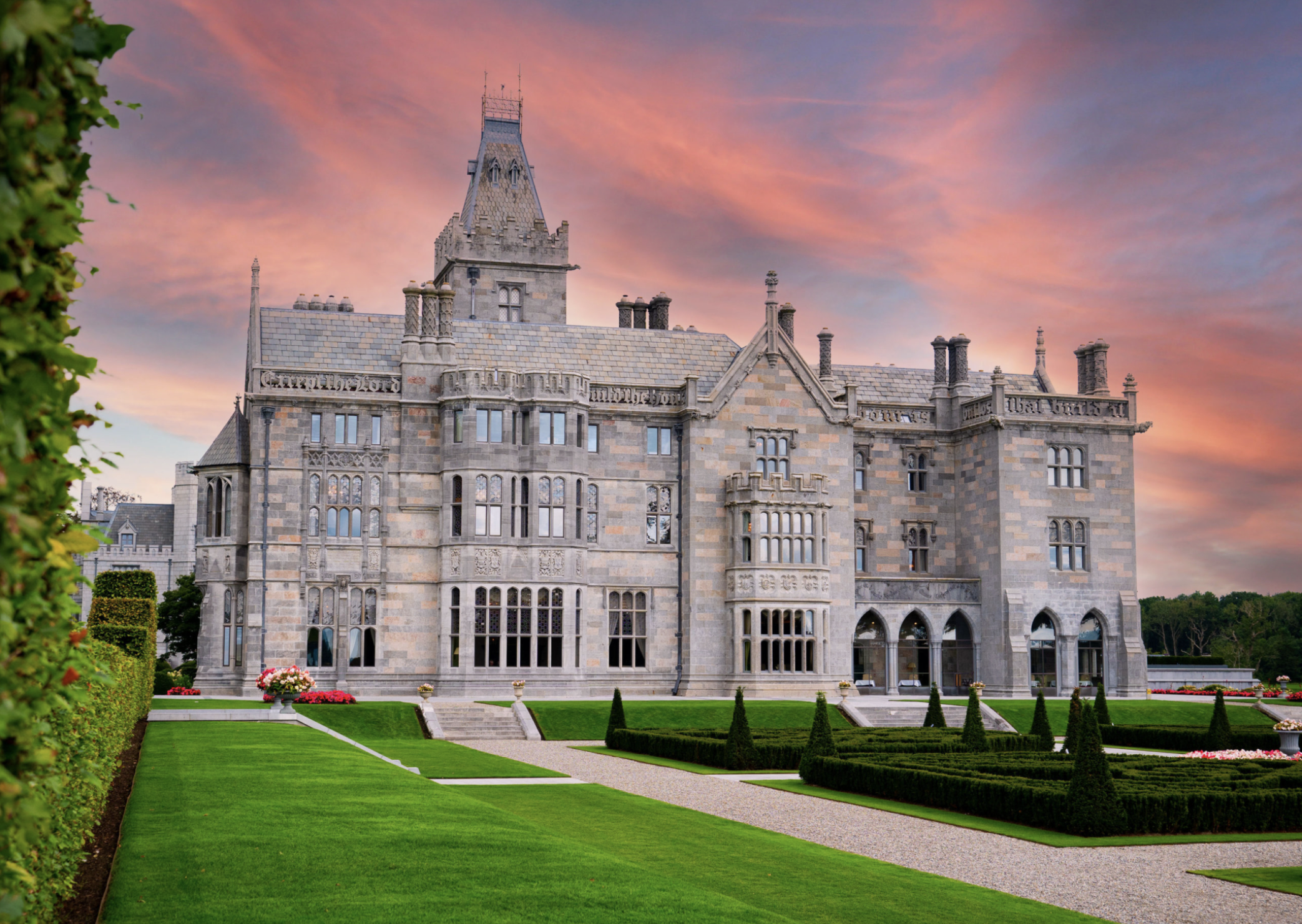 Adare Manor exterior at dusk